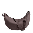 Lieblingstasche Moon Bag Large in a muted mauve tone with a crescent shape and adjustable shoulder strap