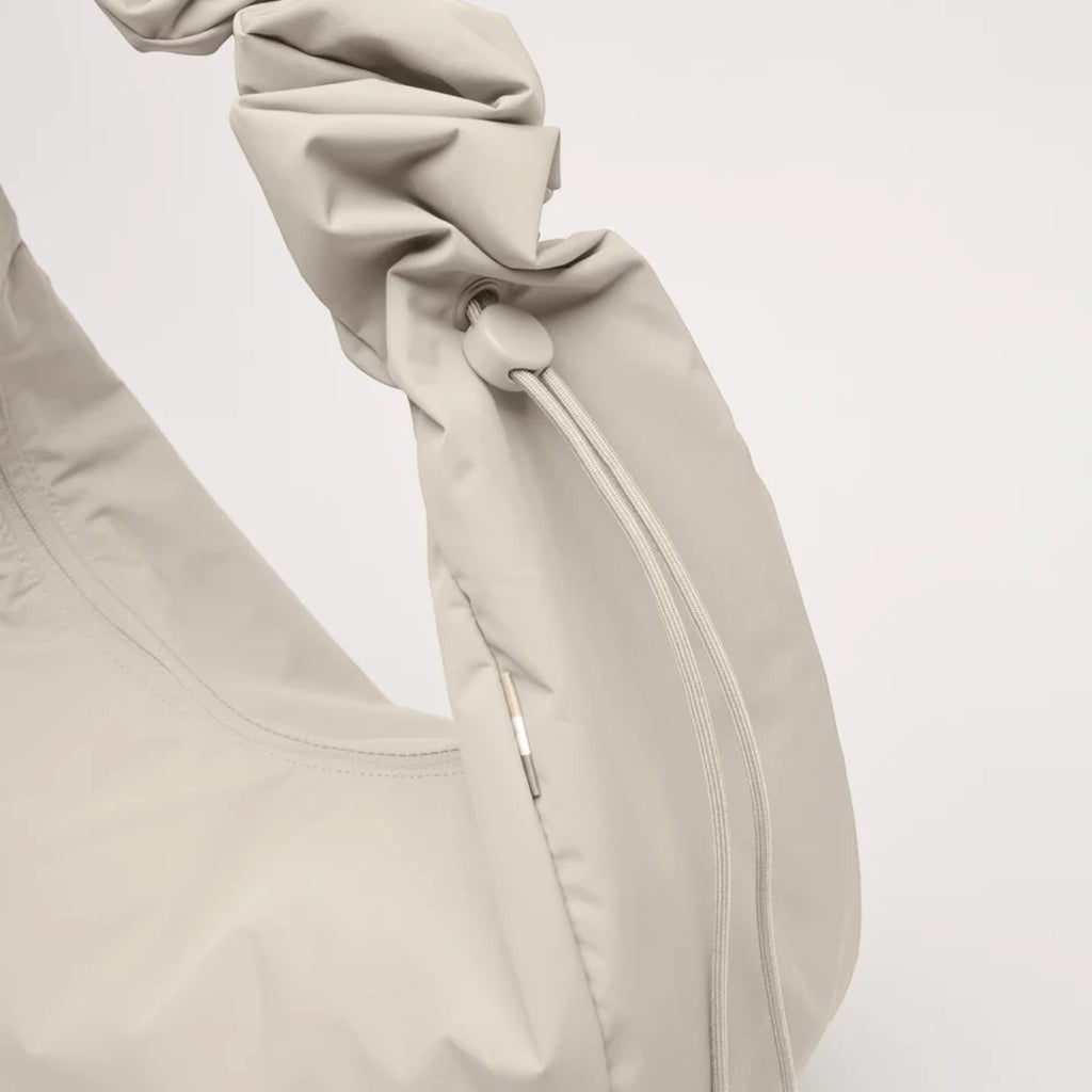 Lieblingstasche Moon Bag Ruffle Large in beige made from recycled fishing nets with a gathered shoulder strap