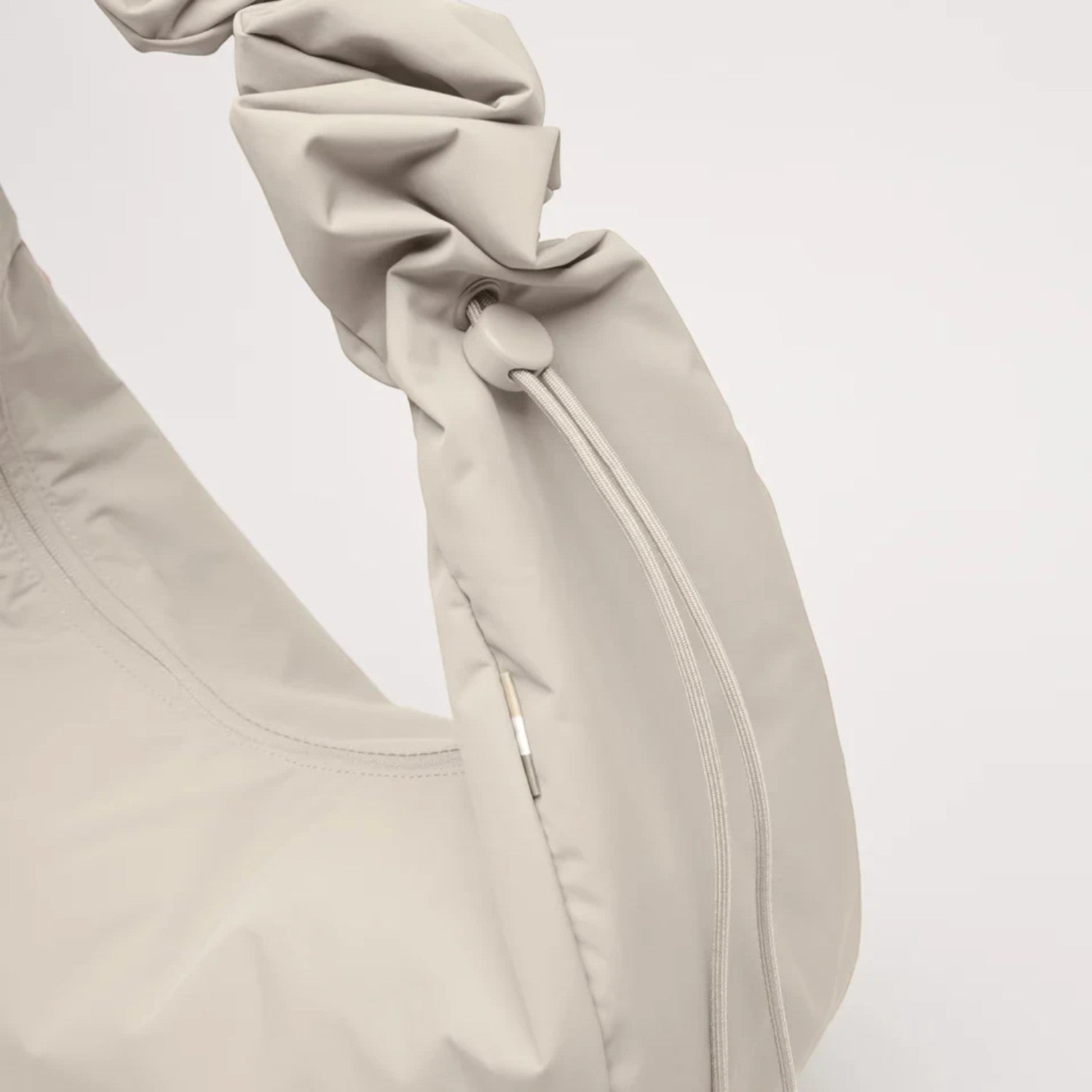 Lieblingstasche Moon Bag Ruffle Large in beige made from recycled fishing nets with a gathered shoulder strap