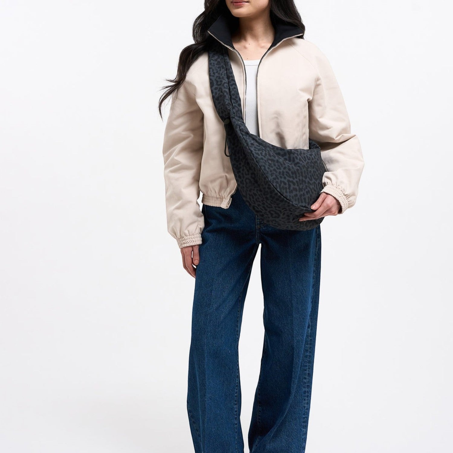 Lieblingstasche Moon Bag Ruffle Large in dark grey cat shark print worn as a crossbody bag by a model
