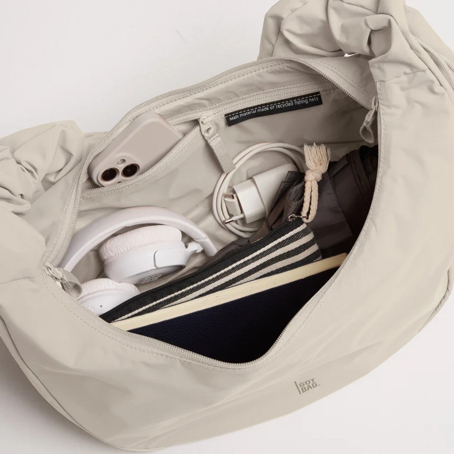 Lieblingstasche Moon Bag Ruffle Large in beige, showing the spacious interior with organized essentials.