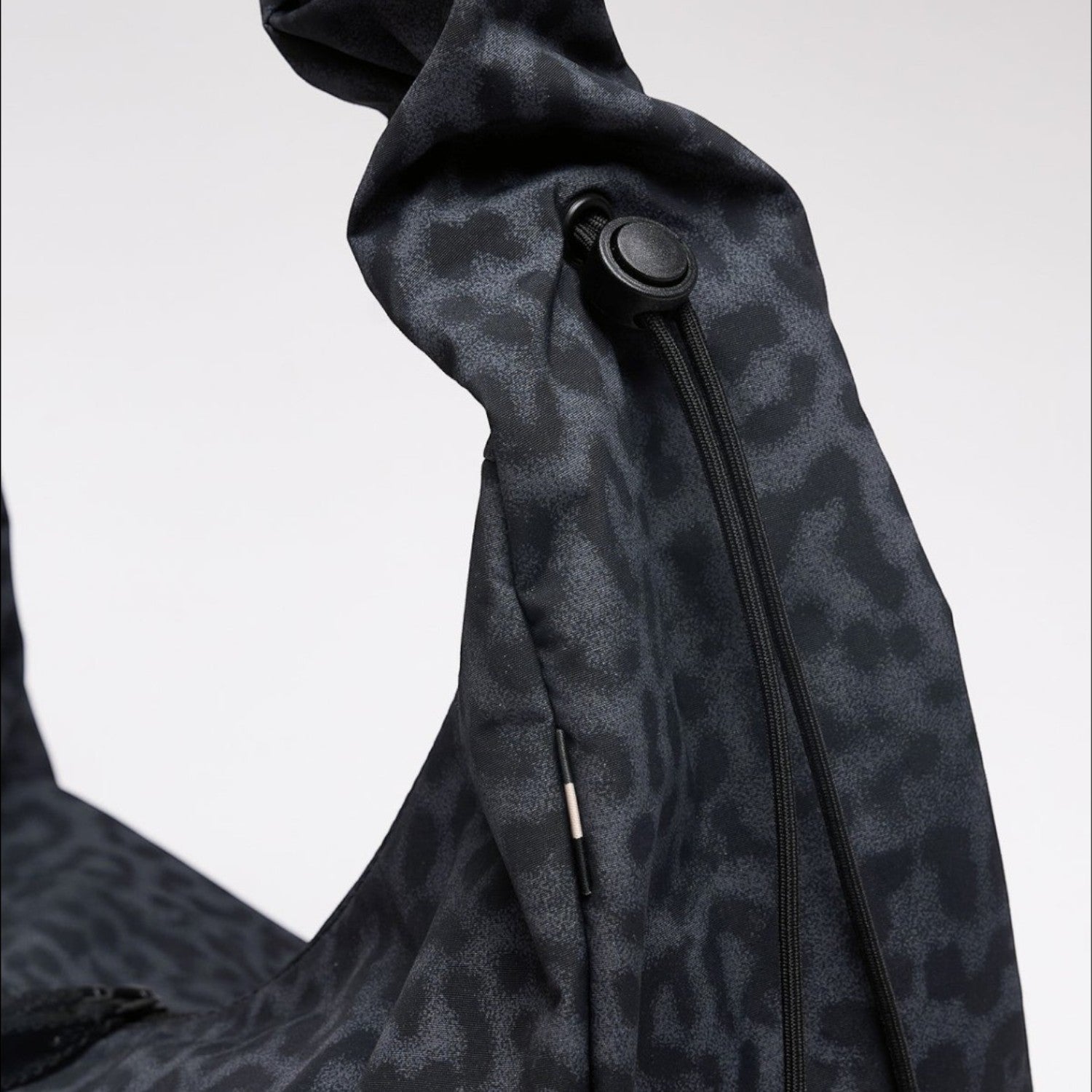 Lieblingstasche Moon Bag Ruffle in dark grey cat shark leopard print with a gathered strap and adjustable toggle