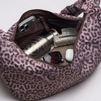 Lieblingstasche Moon Bag Ruffle Large in Cat Shark leopard print with interior contents including a water bottle