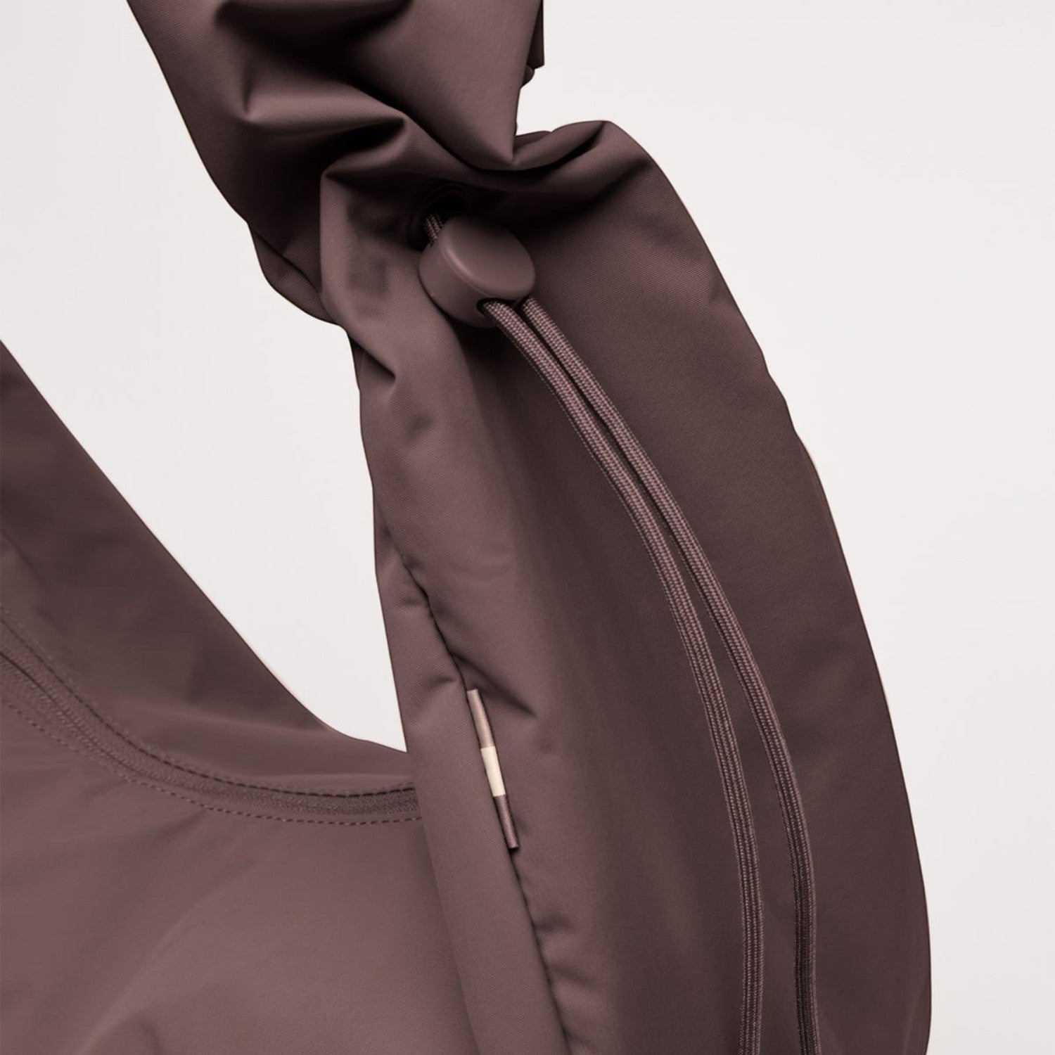 Lieblingstasche Moon Bag Ruffle Large in dark mauve with a gathered scrunchie-style handle and drawstring detail.