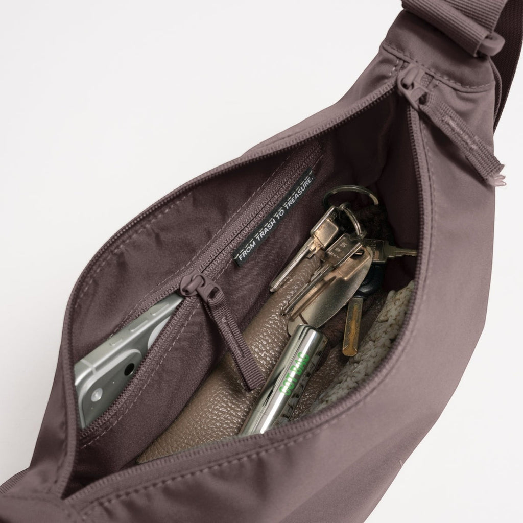 Lieblingstasche Moon Bag Small in mauve with an open zippered main compartment showing interior pockets and keys