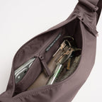 Lieblingstasche Moon Bag Small in mauve with an open zippered main compartment showing interior pockets and keys