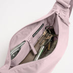 Lieblingstasche Moon Bag Small in dusty pink, showing the interior compartment with keys and a phone