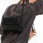 Lieblingstasche Mrs. Whoopie Pie black leather handbag with a kiss-lock closure worn over the shoulder