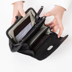 Lieblingstasche Mrs. Whoopie Pie black leather wallet with open kiss-lock clasp and striped interior lining