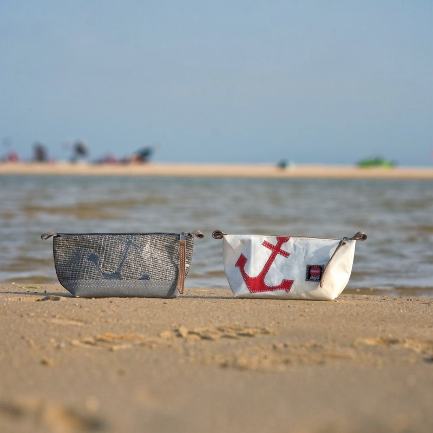 Lieblingstasche Navigator anchor print toiletry bags made from recycled sailcloth on a sandy beach