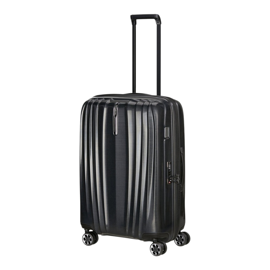 Lieblingstasche NEXIS Spinner 70/26 Exp black hardside suitcase with four wheels and an extendable handle