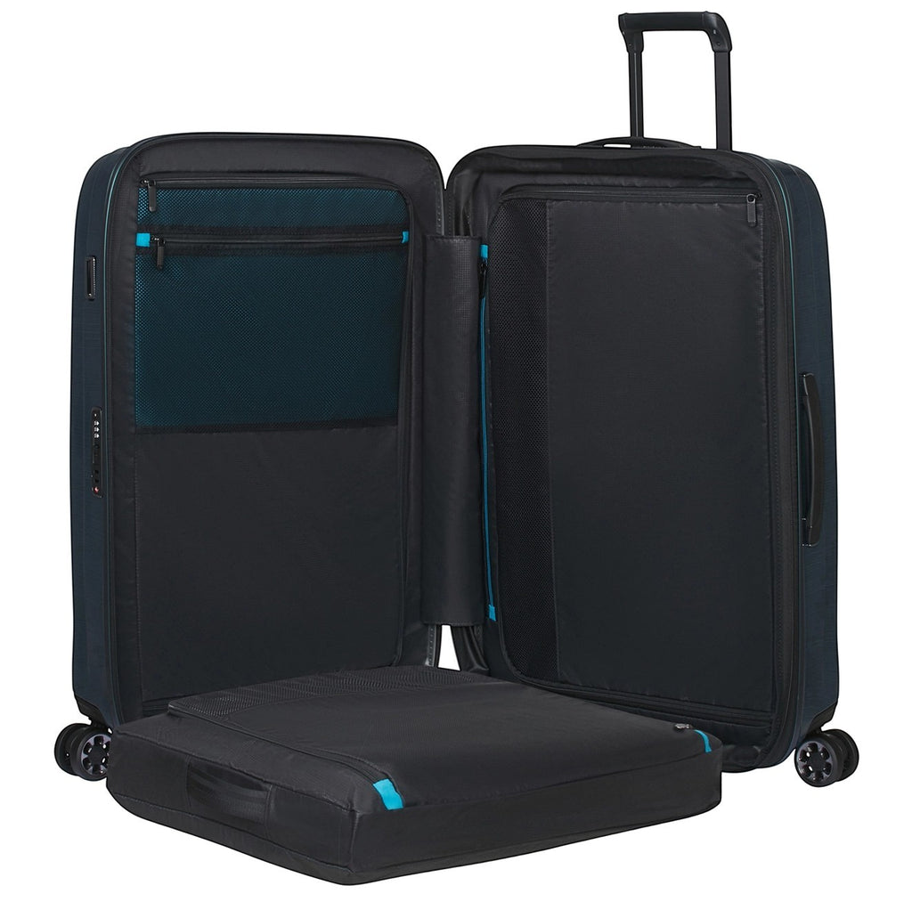 Lieblingstasche NEXIS Spinner 70/26 Exp suitcase open with black interior, mesh pockets, and blue accents
