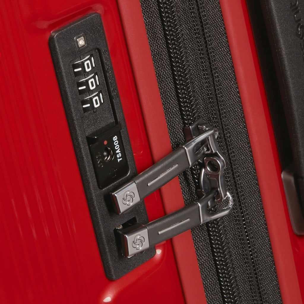 Lieblingstasche NUON Spinner 69/25 red suitcase featuring a secure integrated TSA combination lock and zipper pulls