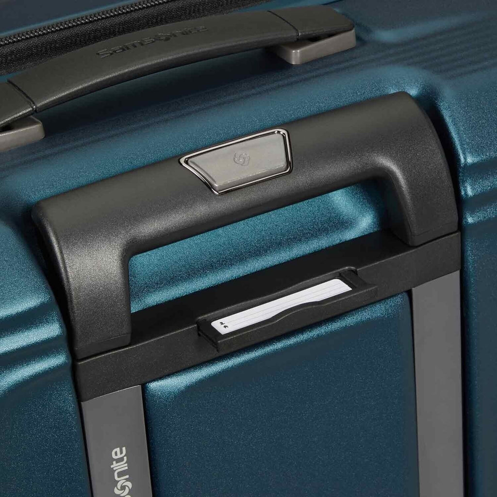 Lieblingstasche NUON Spinner 69/25 Exp suitcase handle and integrated luggage tag in metallic teal blue