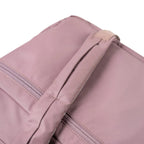 Close-up of the dusty pink Lieblingstasche Omono RE lite backpack featuring durable fabric and a sturdy top handle.
