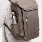 Lieblingstasche Pro Pack taupe backpack with side water bottle pocket and front zip pocket.