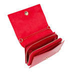 Lieblingstasche red flap bag with multiple zippered compartments and gold hardware.