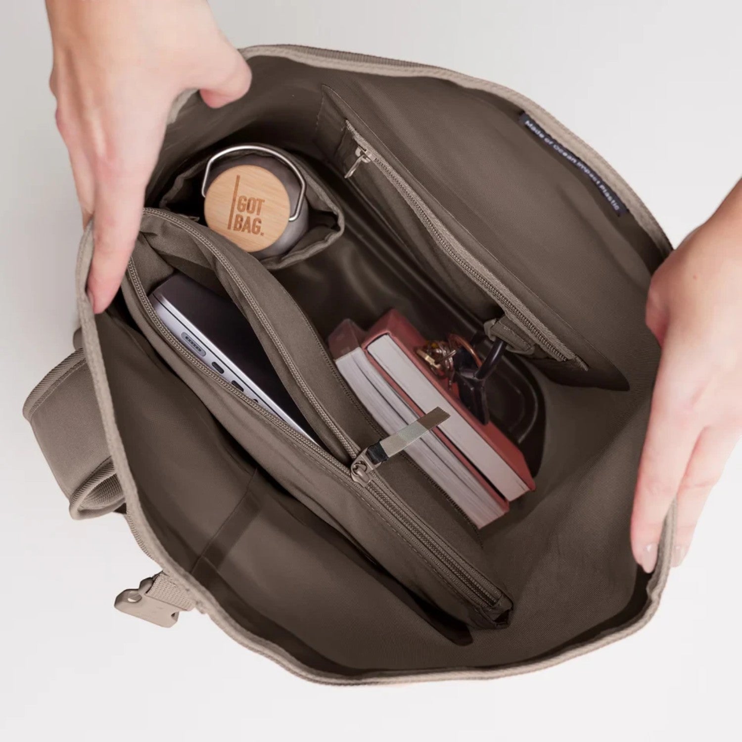 Lieblingstasche GOT BAG Rolltop 2.0 backpack interior showing laptop sleeve, water bottle, and organized compartments.