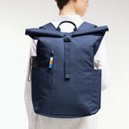 Lieblingstasche Rolltop Easy navy blue backpack with rolltop closure, front zip pocket, and side water bottle holder.