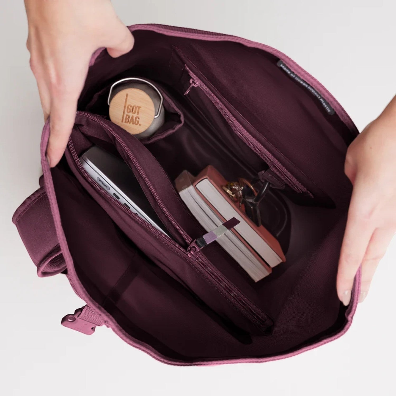 Lieblingstasche GOT BAG Rolltop Lite 2.0 backpack interior showing laptop sleeve, water bottle, and organized pockets