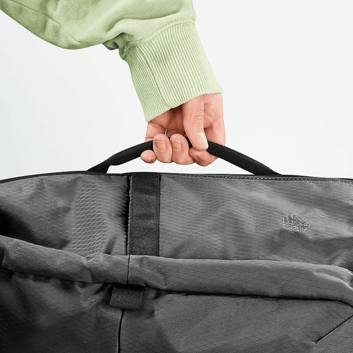 Lieblingstasche Rolly32 charcoal grey rolltop backpack made from recycled water-repellent material held by top handle