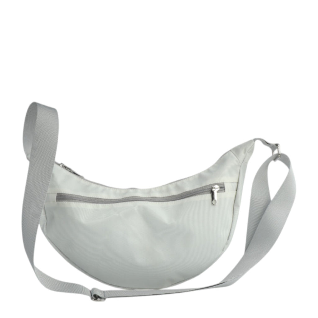 Lieblingstasche Roop moonbag made of water-repellent white sailcloth with an adjustable strap and zipper closure.