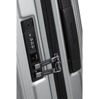 Lieblingstasche Samsonite NUON spinner suitcase featuring a silver hardshell, black zipper, and integrated TSA lock.