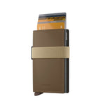 Lieblingstasche Secrid Bandwallet in matte brown with an elastic beige strap and integrated card protector mechanism.
