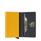 Lieblingstasche Secrid Bandwallet TPU in vibrant yellow with black elastic band and integrated card protector