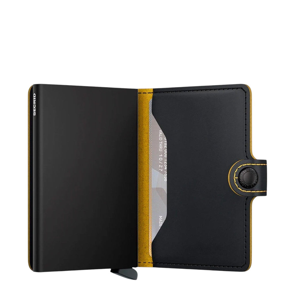 Lieblingstasche Secrid Miniwallet Matte in black leather with yellow interior and RFID-protected card mechanism