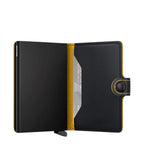Lieblingstasche Secrid Miniwallet Matte in black leather with yellow interior and RFID-protected card mechanism