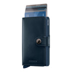 Lieblingstasche Secrid Miniwallet Original in navy blue leather with an aluminium card protector and snap button.
