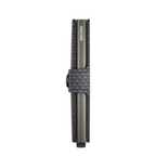 Lieblingstasche Secrid Miniwallet Pyramid in dark grey with a textured geometric pattern and side snap closure