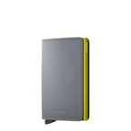 Lieblingstasche Secrid Slimwallet Matte in grey leather with a lime green card protector and contrast stitching.