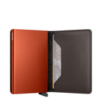 Lieblingstasche Secrid Slimwallet Matte in burnt orange with a dark leather interior and card protection mechanism.