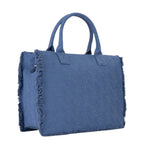 Lieblingstasche Shyla blue denim tote bag with frayed edges and all-over logo pattern.