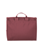 Lieblingstasche Skaii toiletry bag in dark red fabric with a top carry handle against a white background