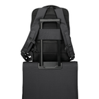 Lieblingstasche Skaii Rucksack M in black, showing the back panel with trolley sleeve attached to a suitcase handle.