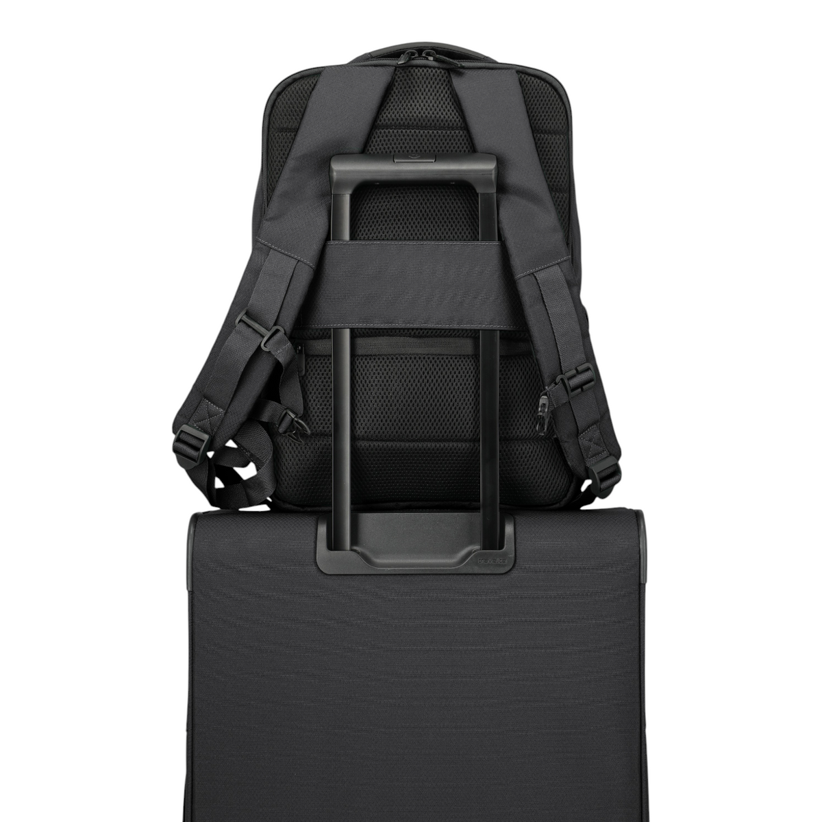 Lieblingstasche Skaii Rucksack M in black, showing the back panel with trolley sleeve attached to a suitcase handle.