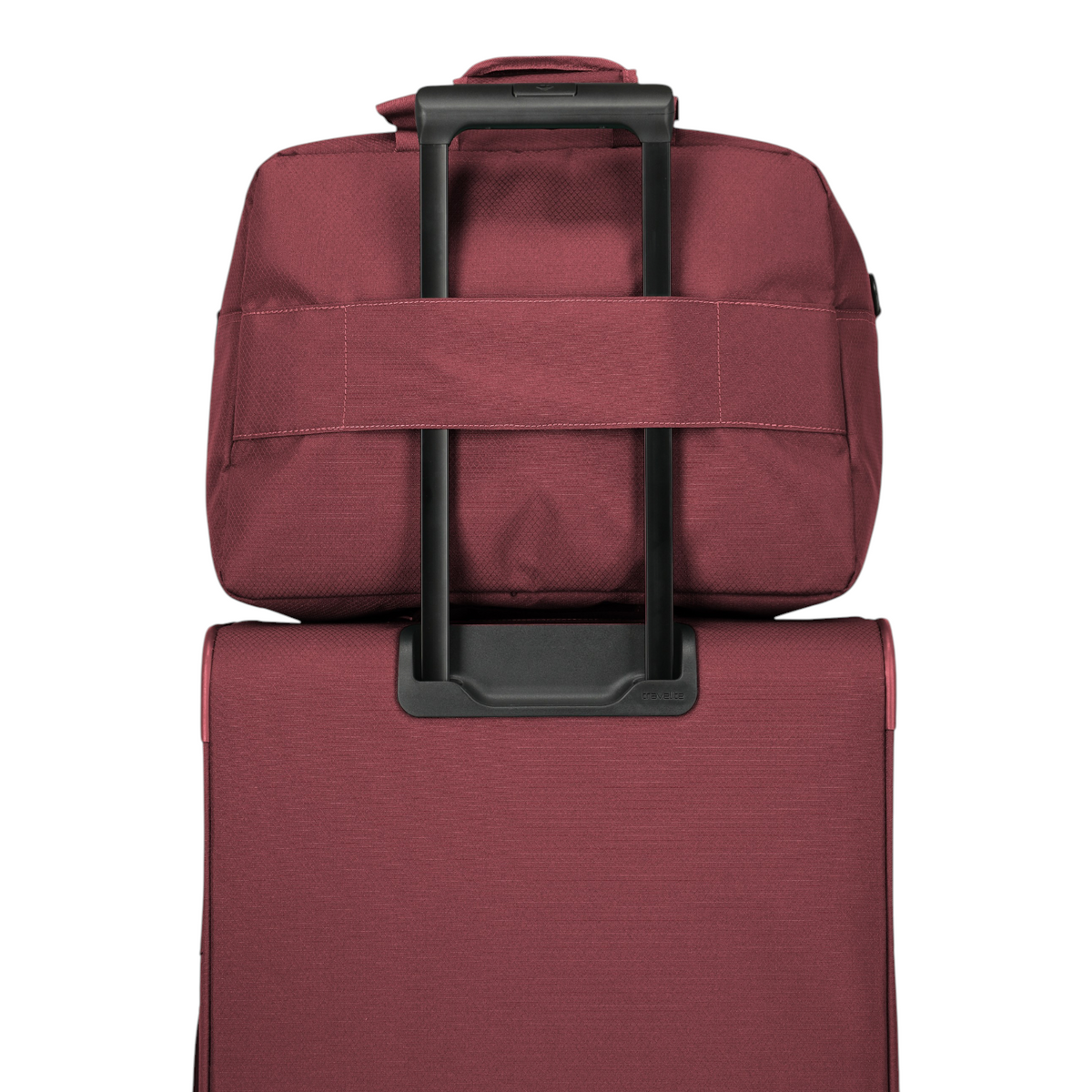 Lieblingstasche Skaii Weekender travel bag in burgundy, featuring a trolley sleeve attached to a matching suitcase.