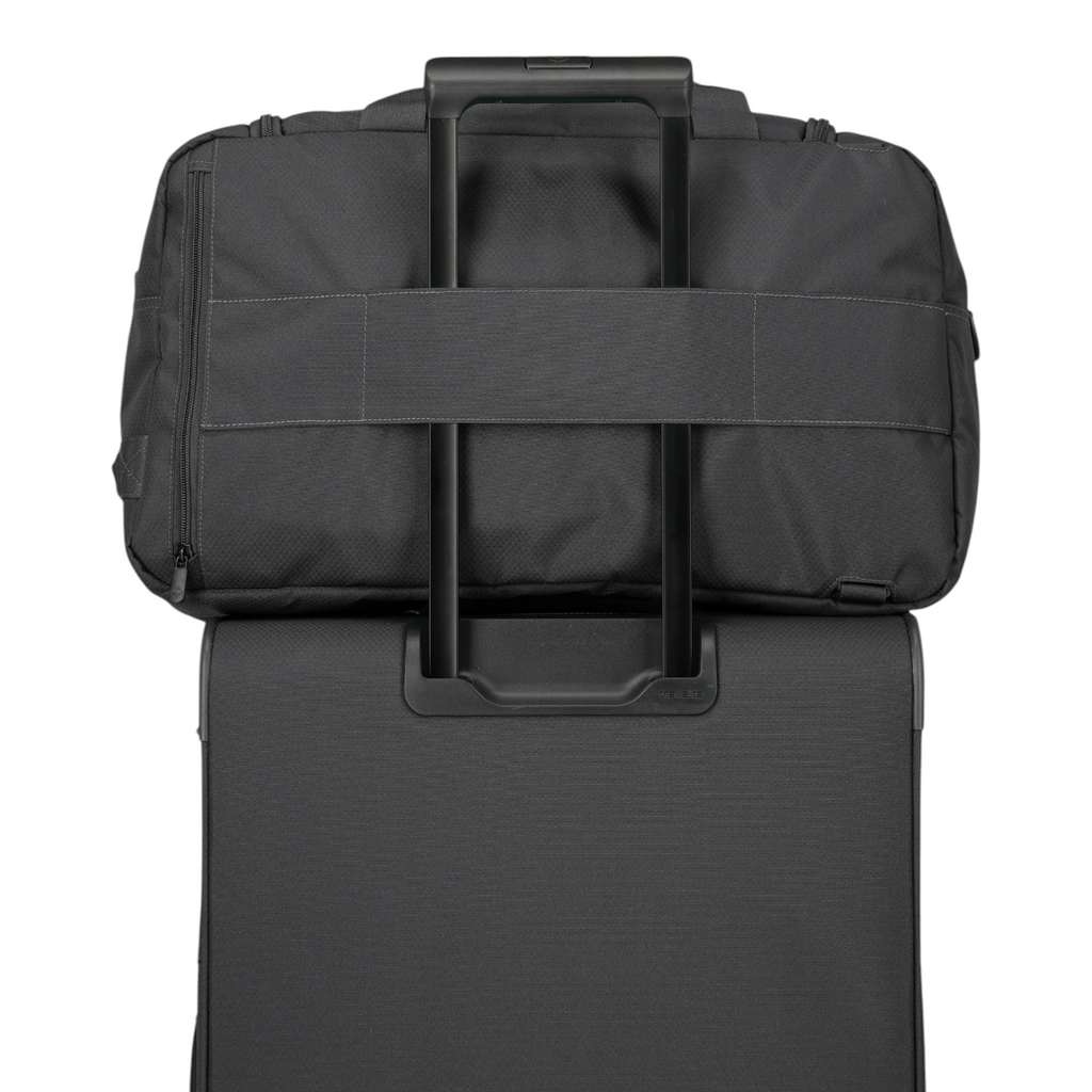 Lieblingstasche Skaii weekender rucksack in black attached to a suitcase handle for travel