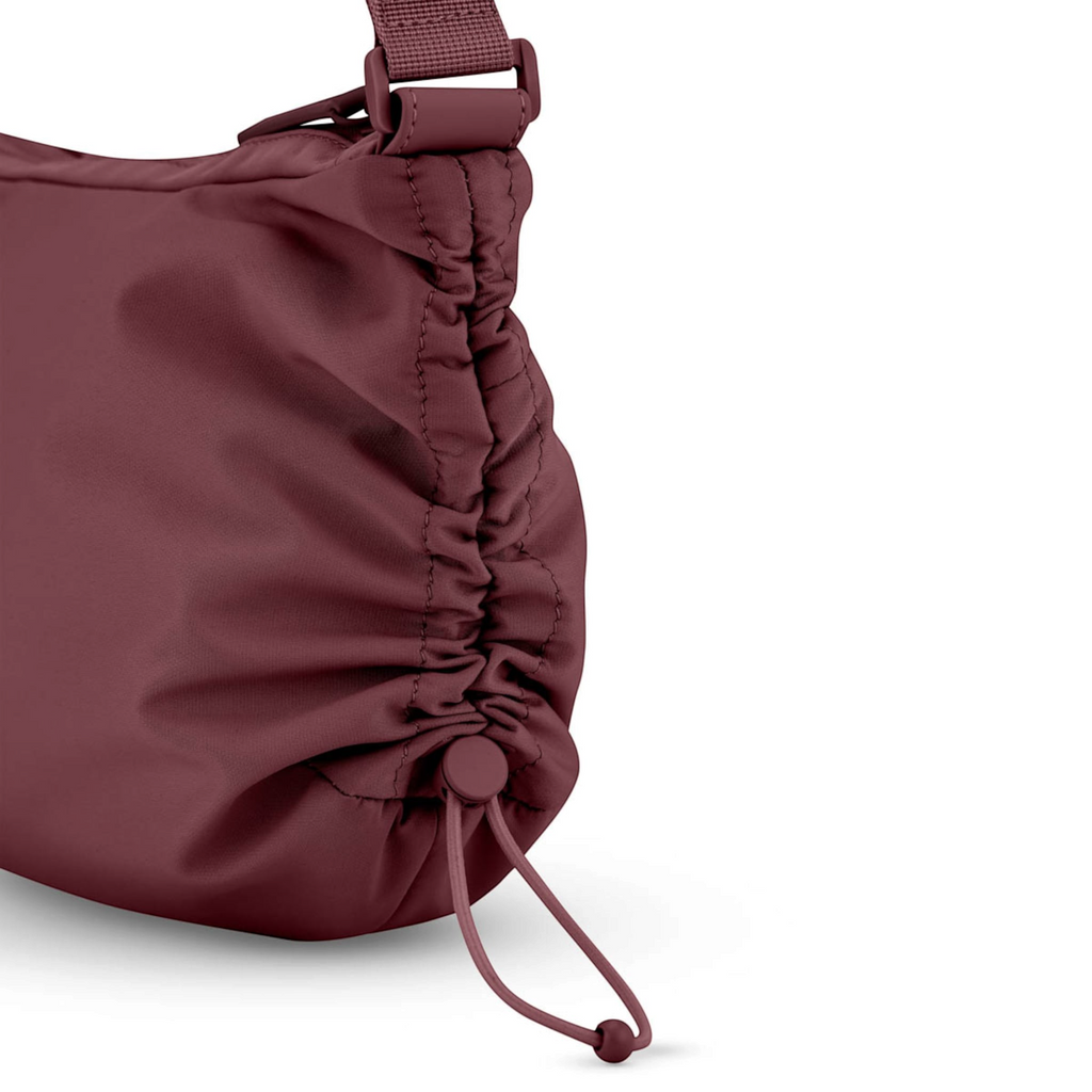 Lieblingstasche Skara Small burgundy nylon shoulder bag with a drawstring side detail and adjustable strap