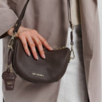 Lieblingstasche Sporty Sister dark brown pebbled leather crossbody bag with gold hardware and matching charm