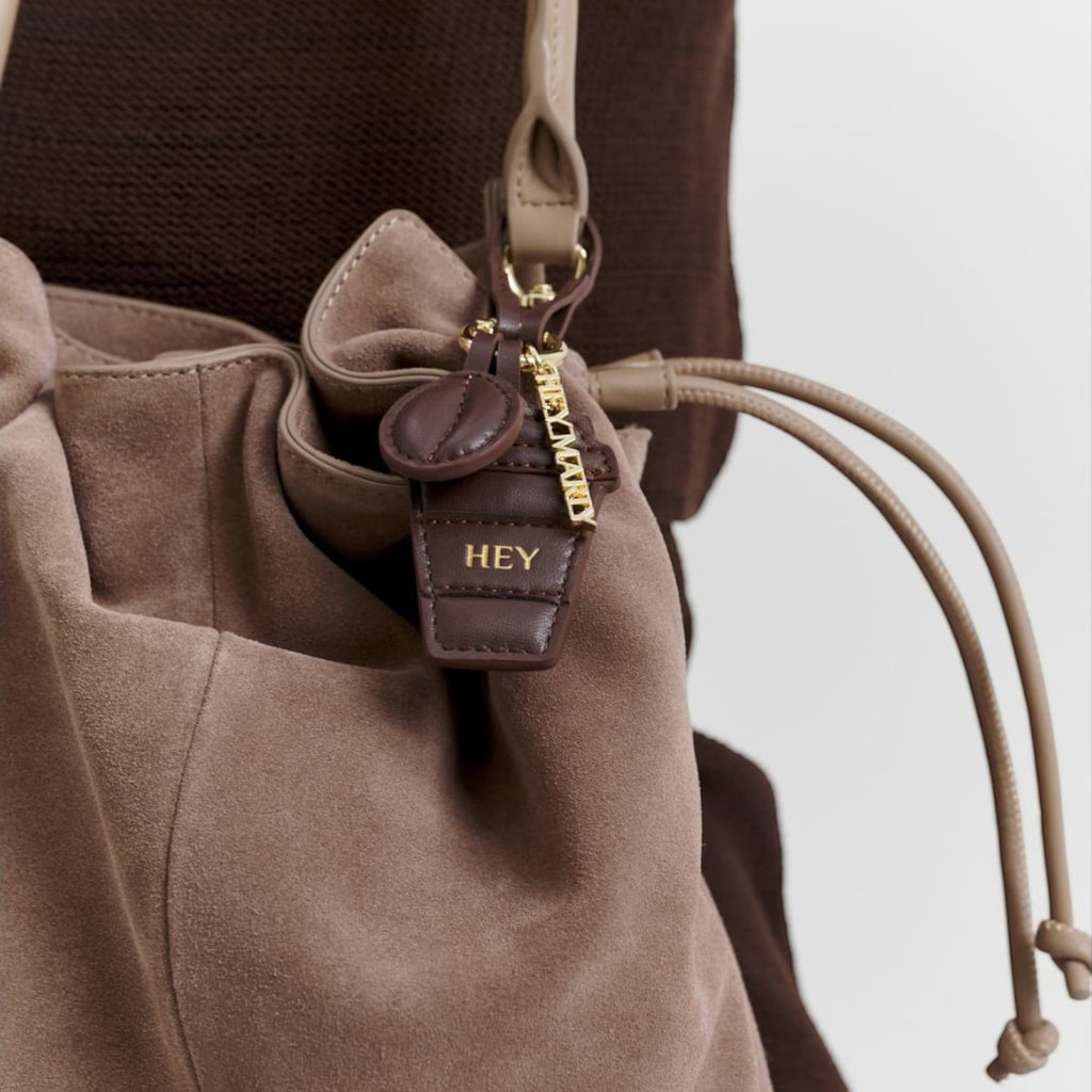 Lieblingstasche Coffee Charm suede bucket bag in taupe with gold hardware and HEY charm detail