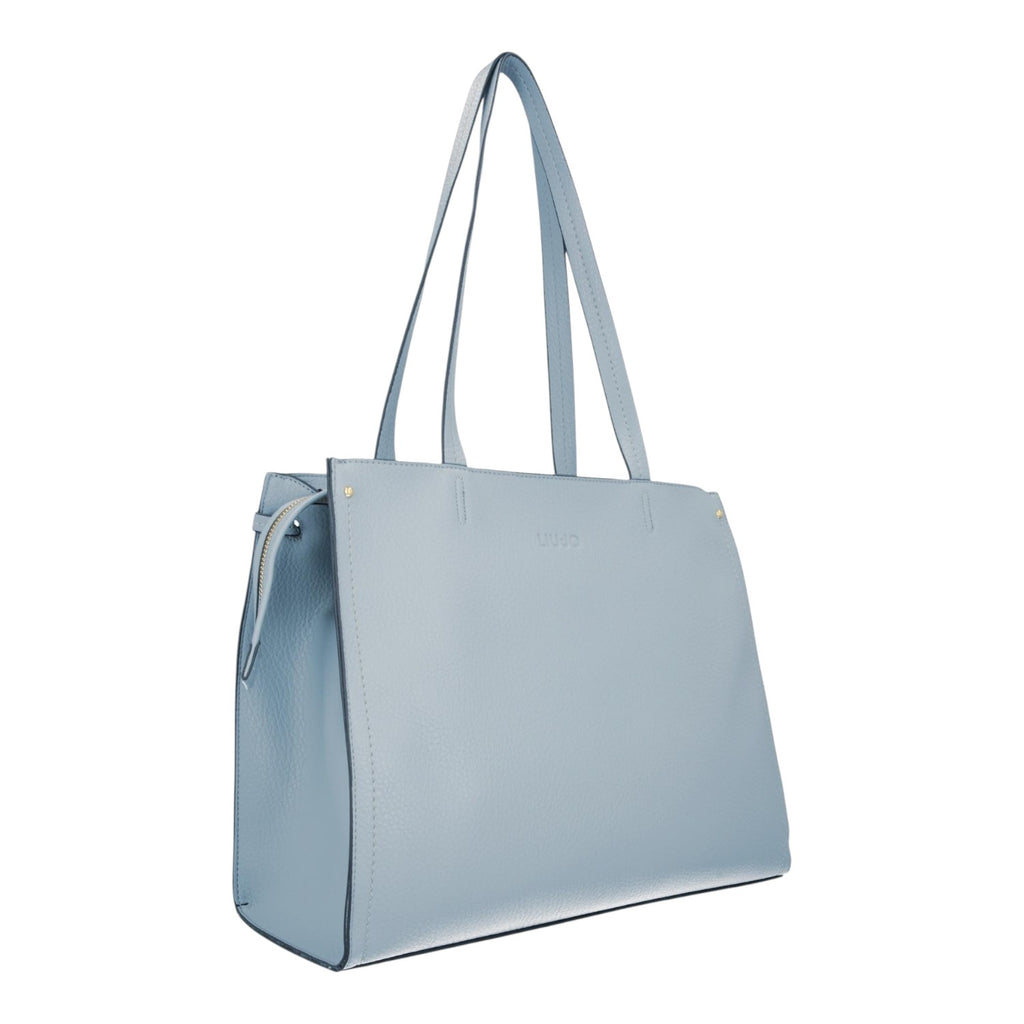 Lieblingstasche Tote L in light blue pebbled faux leather with long shoulder straps and a side zip detail