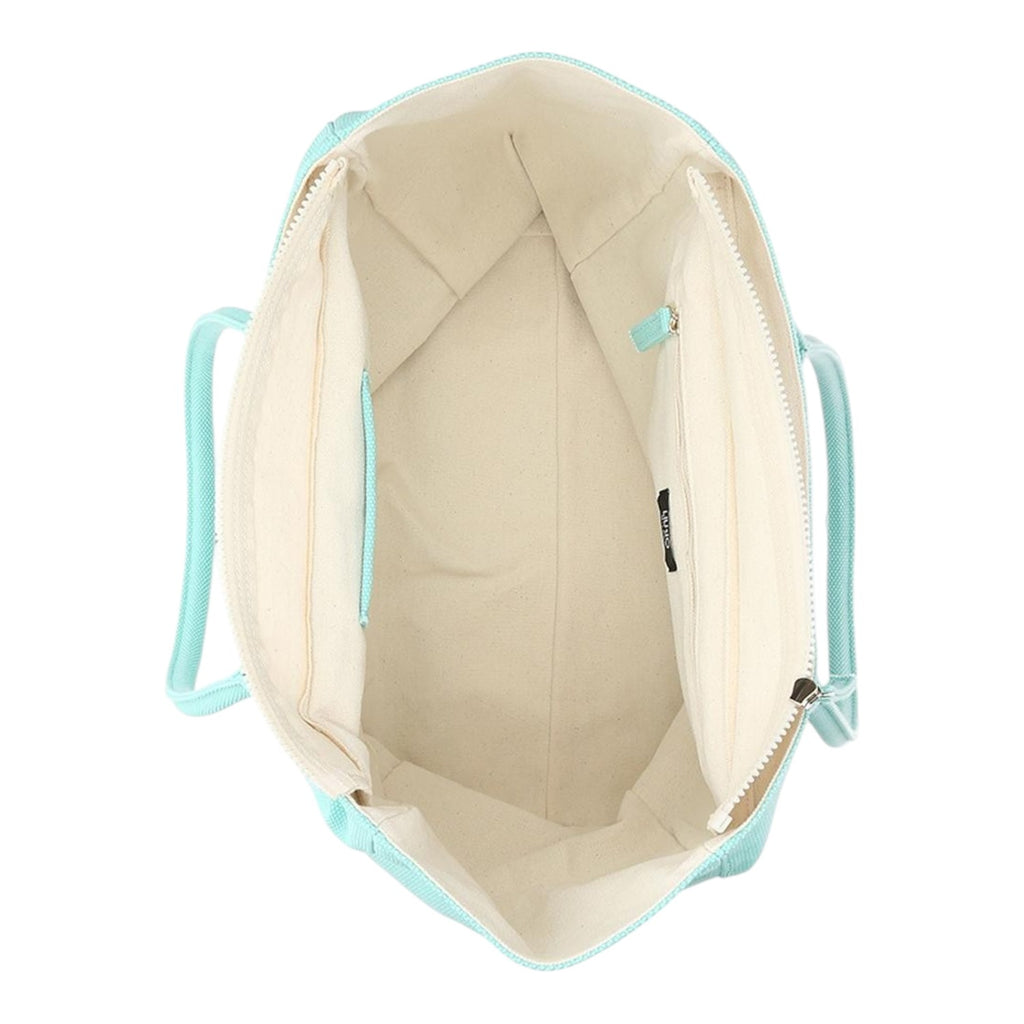 Lieblingstasche Tote L in mint green with a spacious cream interior and zippered compartment, top-down view