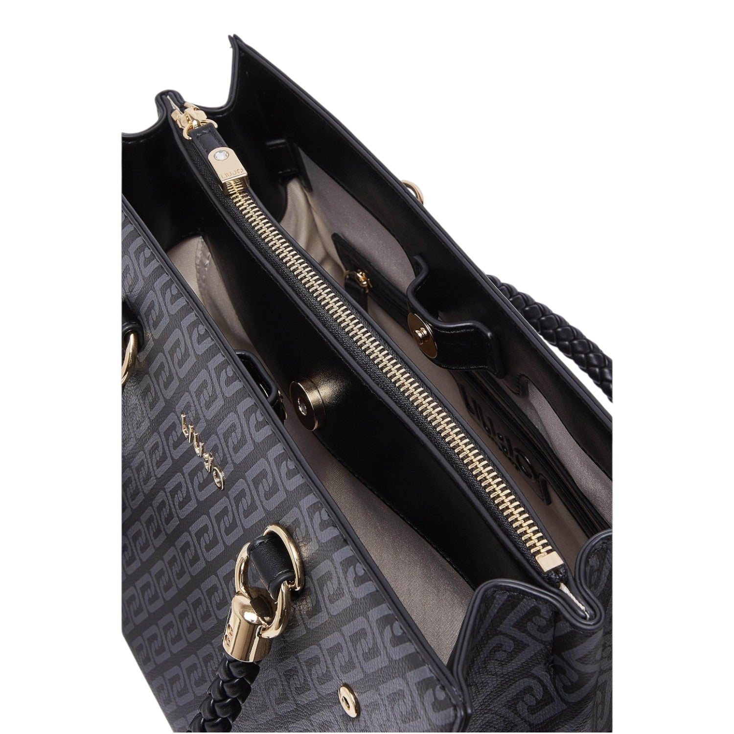 Lieblingstasche Tote M handbag interior with black patterned synthetic leather, gold zipper, and braided handles.