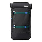Lieblingstasche Trip Pack black backpack with green and blue strap accents and roll-top closure