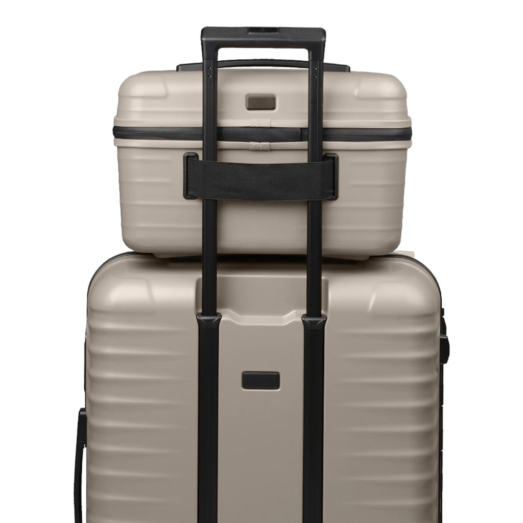 Lieblingstasche UPGRADE beautycase in beige hard shell material attached to a matching suitcase handle