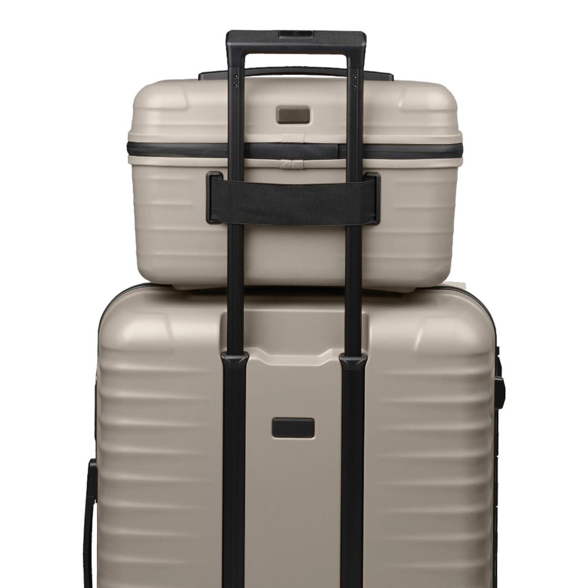 Lieblingstasche UPGRADE beautycase in beige hard shell material attached to a matching suitcase handle